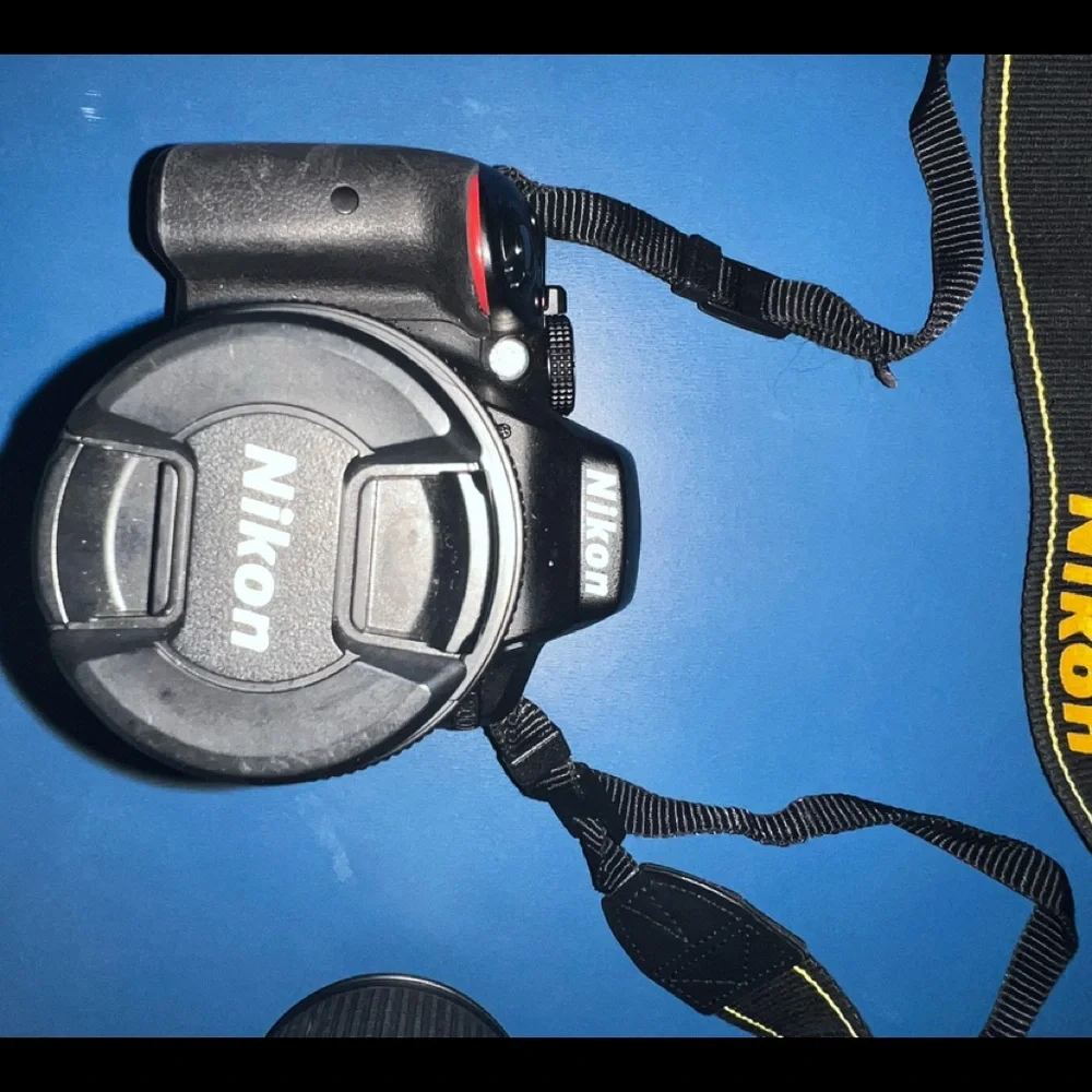 Nikon d5300, 55mm,200mm battery and charger. Camera bag included